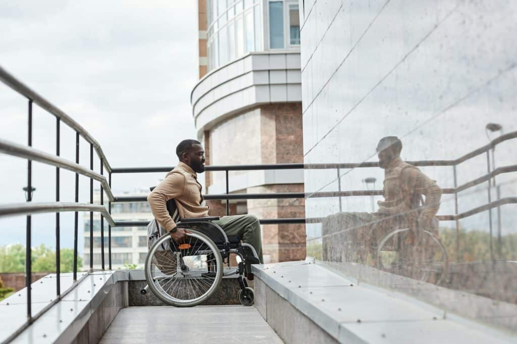 Black Man in Wheelchair using Ramp